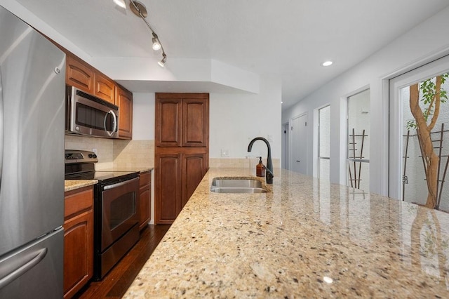 3227 Elizabeth St, Dallas, TX 75204 - kitchen featuring stainless steel appliances, light stone countertops, dark wood-style flooring, tasteful backsplash, and recessed lighting