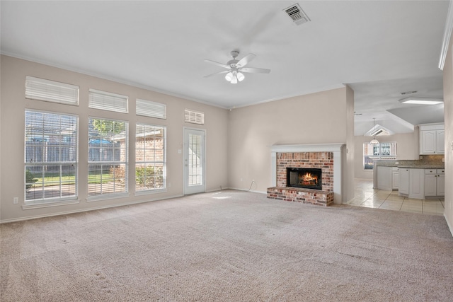 6705 Rolling Hills Dr, North Richland Hills, TX 76182 - unfurnished living room with a ceiling fan, ornamental molding, light colored carpet, a brick fireplace, and baseboards