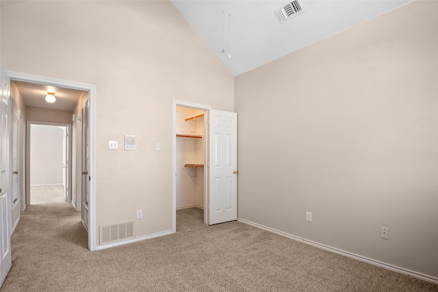 6705 Rolling Hills Dr, North Richland Hills, TX 76182 - unfurnished bedroom featuring carpet flooring, a spacious closet, high vaulted ceiling, baseboards, and attic access