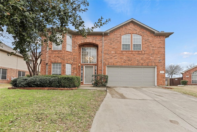 313 Wallford Ln, Lake Dallas, TX 75065 - traditional-style house featuring brick siding, an attached garage, concrete driveway, and a front yard