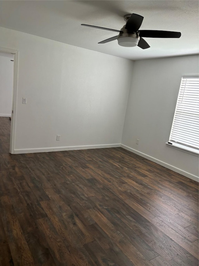 177 Lcr 613 Rd, Groesbeck, TX 76642 - unfurnished room featuring ceiling fan, dark wood-type flooring, and baseboards