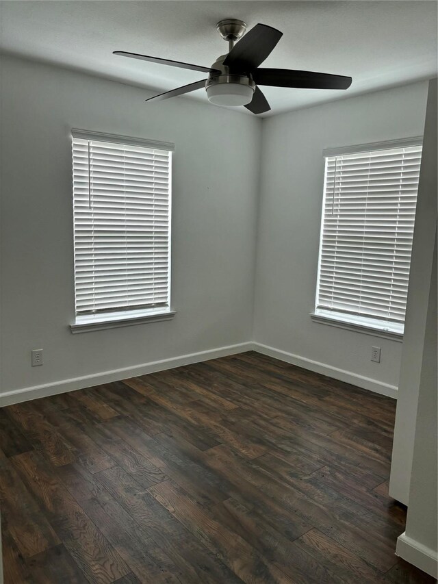 177 Lcr 613 Rd, Groesbeck, TX 76642 - unfurnished room with ceiling fan, dark wood-style floors, and baseboards