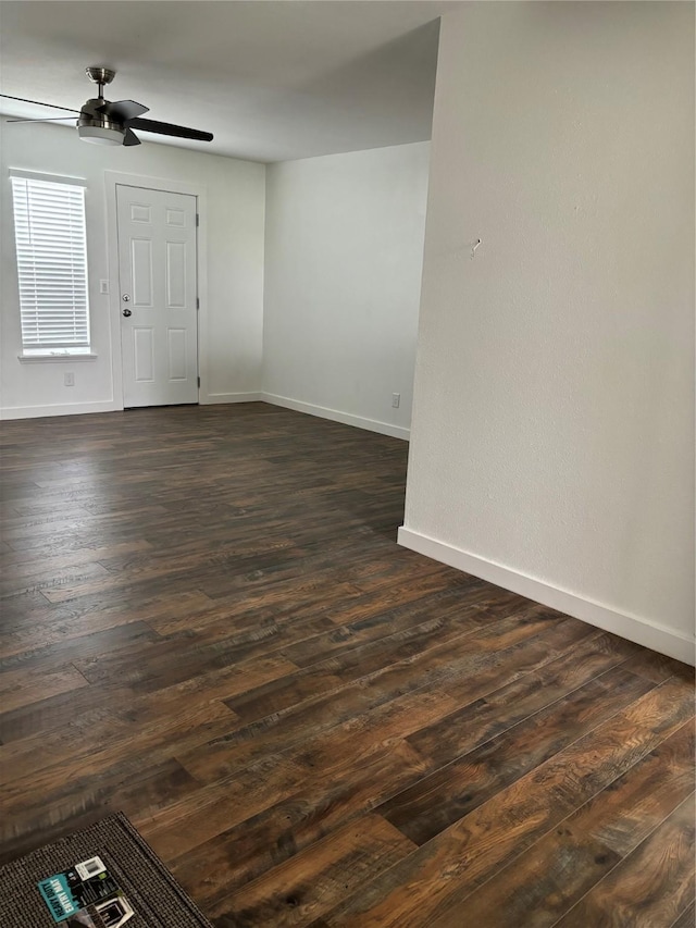 177 Lcr 613 Rd, Groesbeck, TX 76642 - unfurnished room featuring ceiling fan, baseboards, and dark wood finished floors