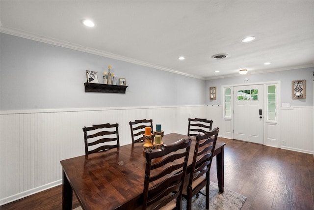 803 S Rusk St, Gainesville, TX 76240 - dining room with wood finished floors, wainscoting, crown molding, and recessed lighting