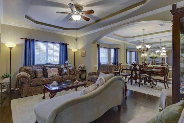 2724 Ferncrest Trl, Mansfield, TX 76063 - living area with a raised ceiling, a ceiling fan, arched walkways, dark wood-style flooring, and ornamental molding