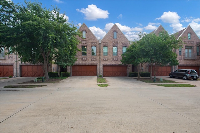6624 Federal Hall St, Plano, TX 75023 - view of property featuring brick siding, concrete driveway, and a garage