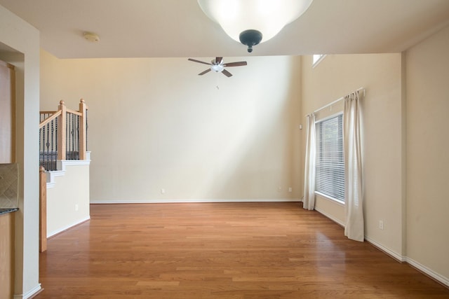 6624 Federal Hall St, Plano, TX 75023 - unfurnished room with ceiling fan, light wood-style flooring, a smoke detector, and baseboards