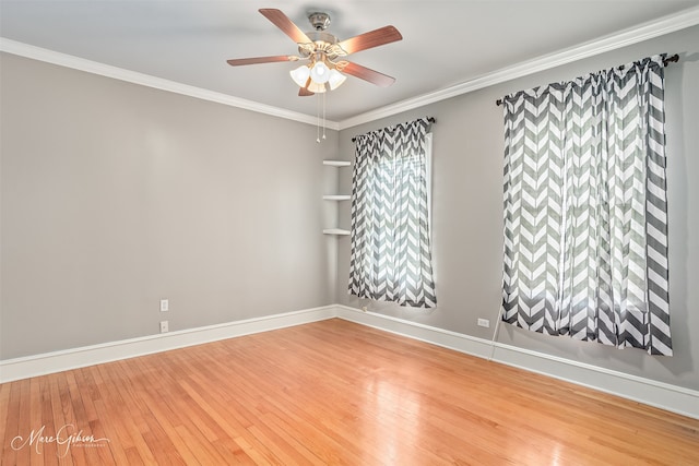 1321 Anniston Ave, Shreveport, LA 71105 - spare room featuring wood finished floors, a ceiling fan, crown molding, and baseboards