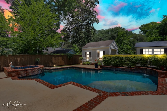 1321 Anniston Ave, Shreveport, LA 71105 - view of pool featuring a patio area, a fenced backyard, an outbuilding, and a pool with connected hot tub