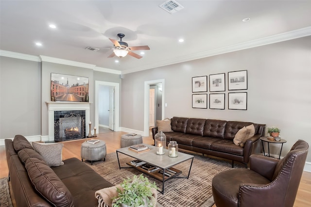 1321 Anniston Ave, Shreveport, LA 71105 - living room with light wood finished floors, ceiling fan, crown molding, recessed lighting, and a premium fireplace