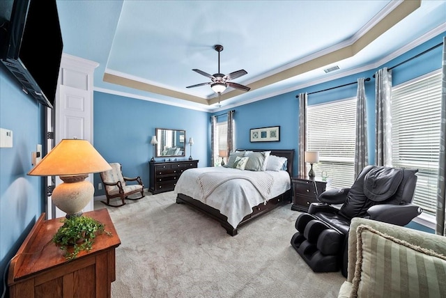 1304 Salsbury Cir, Murphy, TX 75094 - bedroom featuring a tray ceiling, ornamental molding, light colored carpet, and a ceiling fan