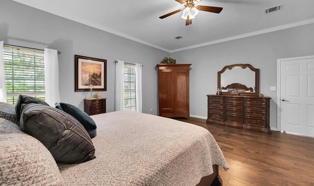 804 Heritage Pkwy, Axtell, TX 76624 - bedroom with dark wood finished floors, crown molding, baseboards, and ceiling fan