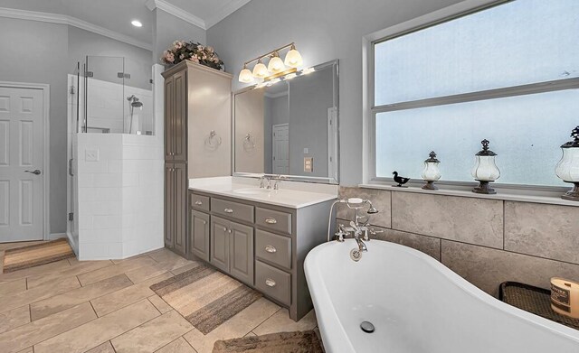 804 Heritage Pkwy, Axtell, TX 76624 - bathroom with ornamental molding, a soaking tub, a shower stall, and vanity