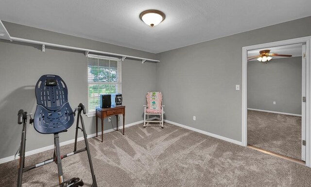 804 Heritage Pkwy, Axtell, TX 76624 - exercise room featuring carpet flooring, baseboards, and a ceiling fan