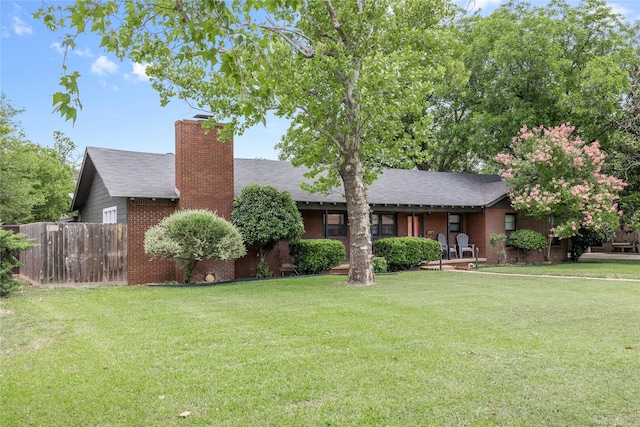 2202 Belmeade Ave, Brownwood, TX 76801 - ranch-style home featuring brick siding, a chimney, and a shingled roof
