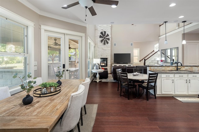 1814 Stacy Rd, Fairview, TX 75069 - dining area featuring a ceiling fan, dark wood-style floors, french doors, a fireplace, and stairs