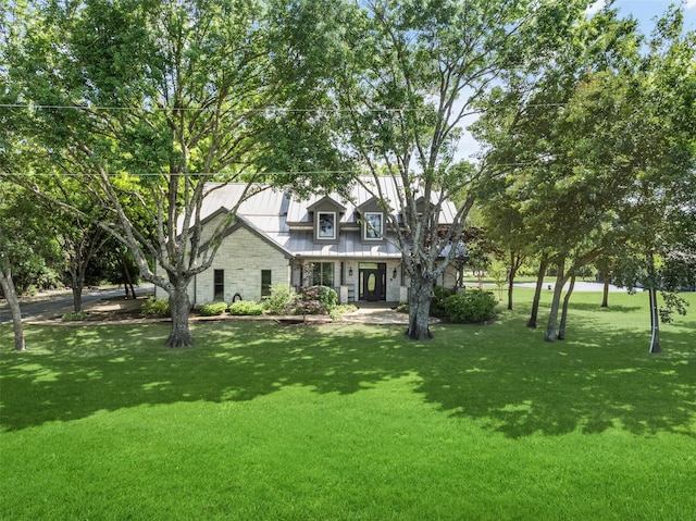 1814 Stacy Rd, Fairview, TX 75069 - view of front of house with a front lawn, metal roof, a standing seam roof, and stone siding