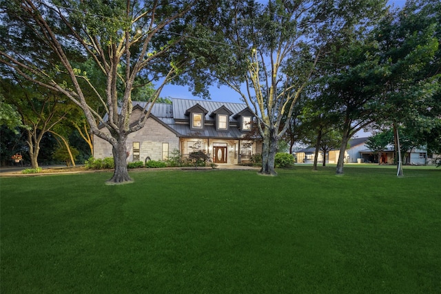 1814 Stacy Rd, Fairview, TX 75069 - view of front of home with a standing seam roof, a front lawn, stone siding, and metal roof
