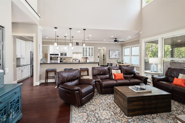 1814 Stacy Rd, Fairview, TX 75069 - living area with dark wood-style flooring, a towering ceiling, ceiling fan, recessed lighting, and ornamental molding