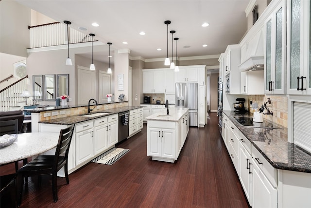 1814 Stacy Rd, Fairview, TX 75069 - kitchen with a sink, a spacious island, stainless steel appliances, tasteful backsplash, and recessed lighting