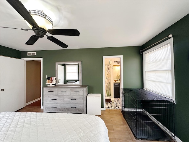 4098 Avondale St, Abilene, TX 79605 - bedroom featuring wood finished floors, a ceiling fan, and connected bathroom