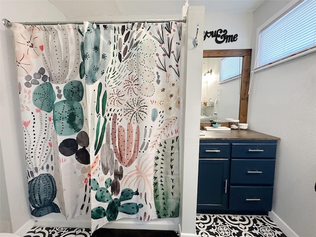 4098 Avondale St, Abilene, TX 79605 - bathroom featuring vanity, baseboards, and curtained shower