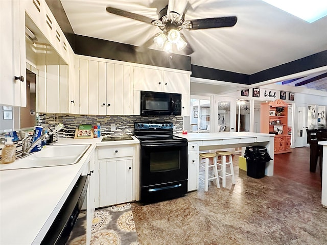 4098 Avondale St, Abilene, TX 79605 - kitchen with black appliances, a ceiling fan, decorative backsplash, light countertops, and white cabinetry