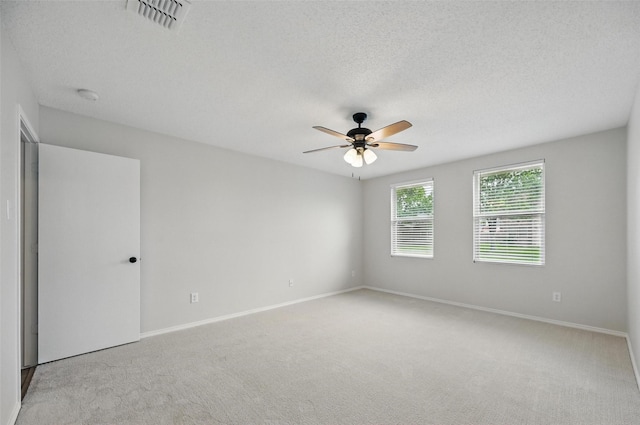 2922 Sheridan Ln, Wylie, TX 75098 - carpeted empty room featuring ceiling fan, baseboards, a textured ceiling, and a smoke detector