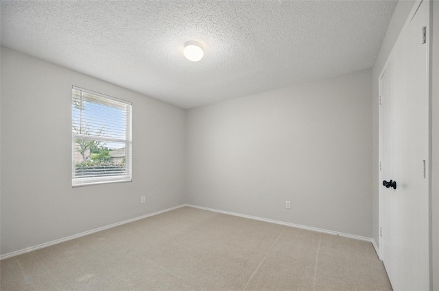 2922 Sheridan Ln, Wylie, TX 75098 - empty room with light colored carpet, a textured ceiling, and baseboards
