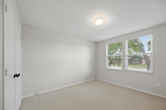 2922 Sheridan Ln, Wylie, TX 75098 - unfurnished bedroom featuring a textured ceiling, light colored carpet, and baseboards