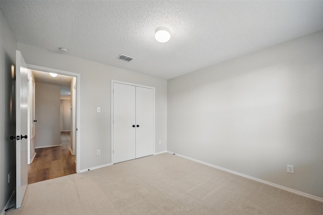 2922 Sheridan Ln, Wylie, TX 75098 - unfurnished bedroom featuring carpet flooring, a textured ceiling, a closet, and baseboards