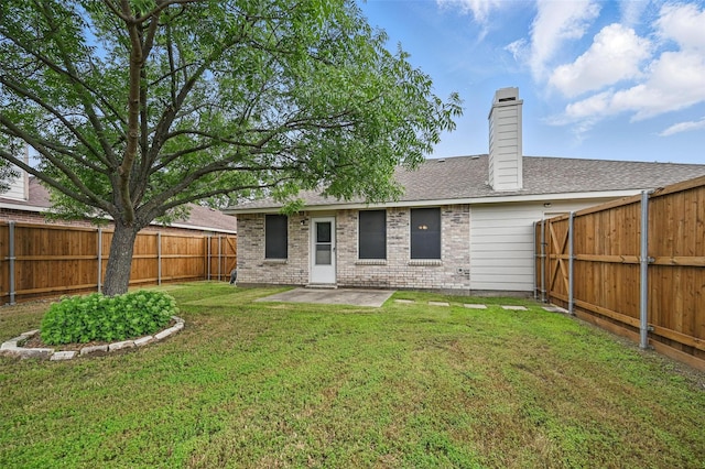 2922 Sheridan Ln, Wylie, TX 75098 - rear view of property featuring a patio area, a chimney, roof with shingles, and brick siding