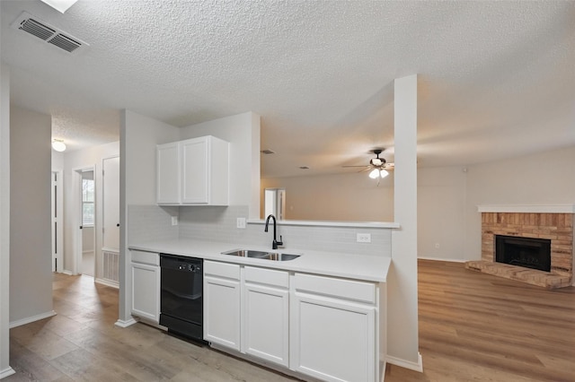 2922 Sheridan Ln, Wylie, TX 75098 - kitchen with a sink, dishwasher, decorative backsplash, light wood-style floors, and open floor plan