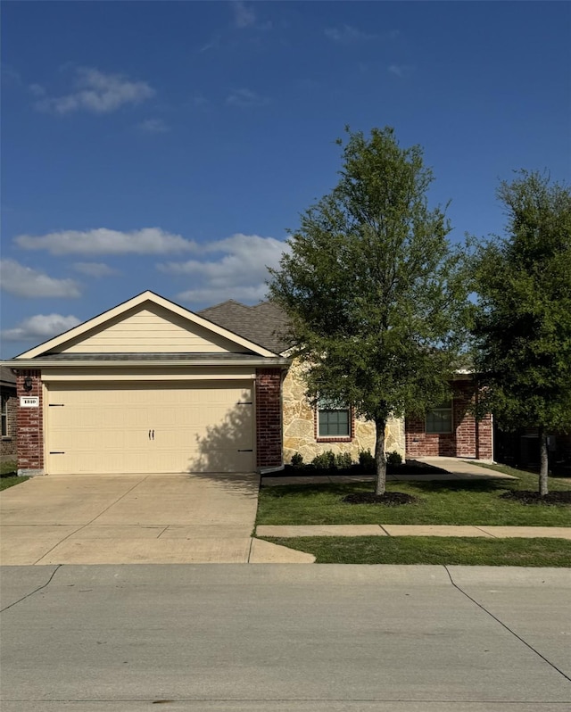 1310 Granite Path, Princeton, TX 75407 - ranch-style house with a garage, brick siding, and driveway