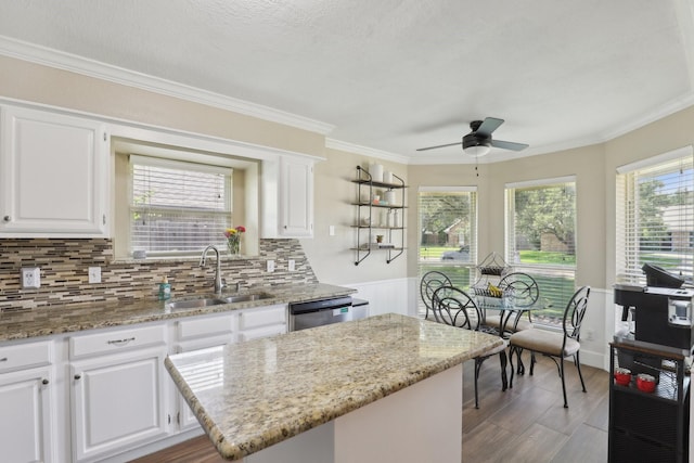 9 Chimney Rock Dr, Trophy Club, TX 76262 - kitchen featuring a sink, a ceiling fan, dishwasher, light stone counters, and crown molding