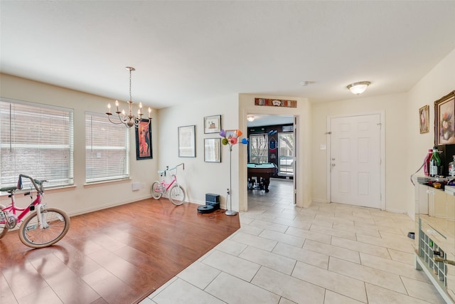 225 Redhead Dr, Little Elm, TX 75068 - entrance foyer featuring a chandelier, light tile patterned floors, pool table, and baseboards