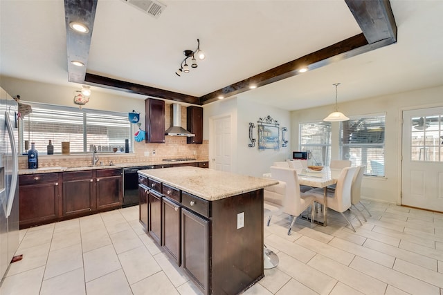 225 Redhead Dr, Little Elm, TX 75068 - kitchen featuring wall chimney exhaust hood, gas cooktop, decorative backsplash, light tile patterned flooring, and black dishwasher