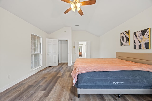 8901 Elbe Trl, Fort Worth, TX 76118 - bedroom with vaulted ceiling, wood finished floors, baseboards, and a ceiling fan