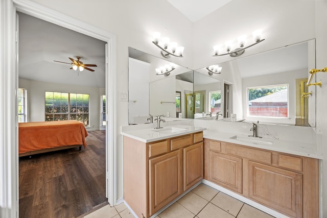 8901 Elbe Trl, Fort Worth, TX 76118 - full bath with double vanity, vaulted ceiling, ceiling fan, ensuite bath, and tile patterned floors