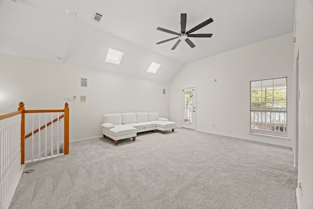 8901 Elbe Trl, Fort Worth, TX 76118 - living room featuring lofted ceiling, healthy amount of natural light, a skylight, and carpet floors