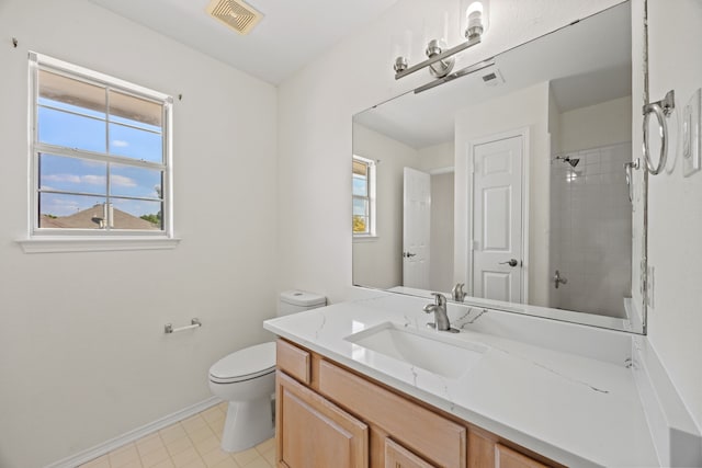 8901 Elbe Trl, Fort Worth, TX 76118 - full bathroom featuring toilet, vanity, healthy amount of natural light, and baseboards