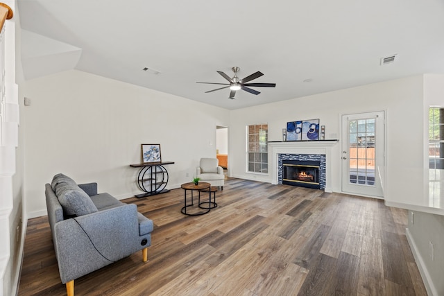 8901 Elbe Trl, Fort Worth, TX 76118 - living area with ceiling fan, wood finished floors, a tiled fireplace, and baseboards