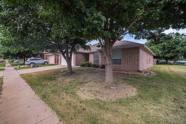 600 Swift Current Dr, Crowley, TX 76036 - view of front of property with brick siding, a front lawn, concrete driveway, and a garage