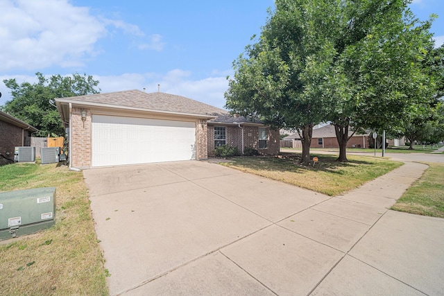 600 Swift Current Dr, Crowley, TX 76036 - ranch-style house with brick siding, driveway, a front yard, an attached garage, and central AC