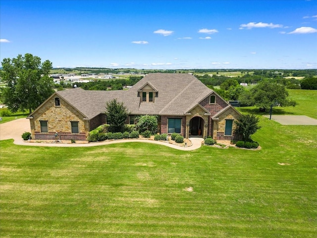 120 Trail Rdg, Weatherford, TX 76087 - view of front of property featuring a front lawn, brick siding, a shingled roof, and stone siding