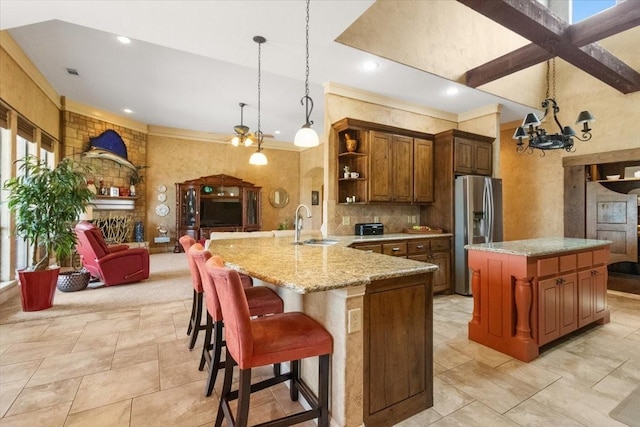 120 Trail Rdg, Weatherford, TX 76087 - kitchen with stainless steel fridge with ice dispenser, open shelves, a sink, ornamental molding, and light stone countertops