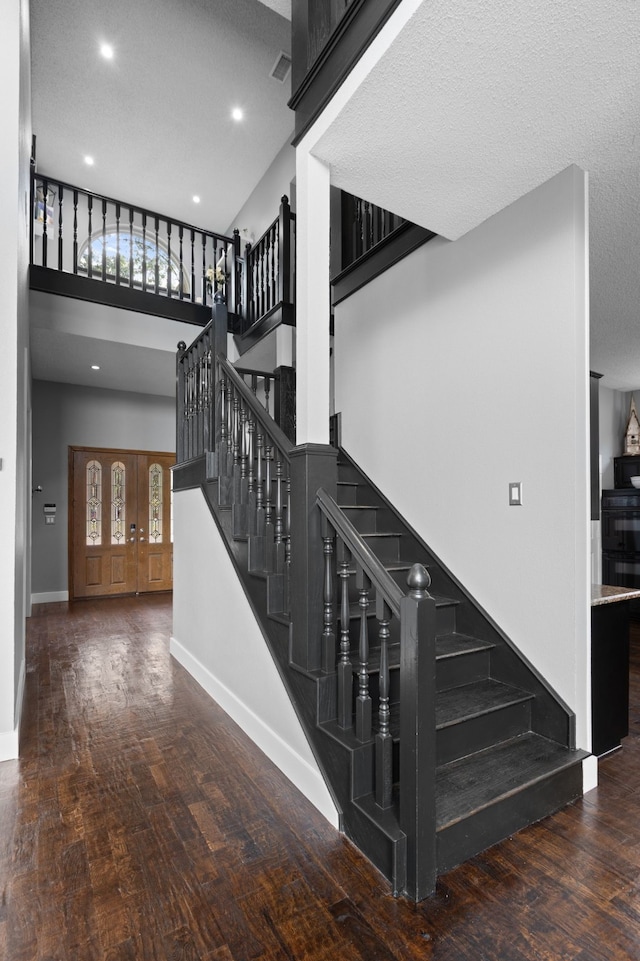 2304 Colleen Ct, Carrollton, TX 75007 - stairs with wood finished floors, plenty of natural light, recessed lighting, and a high ceiling