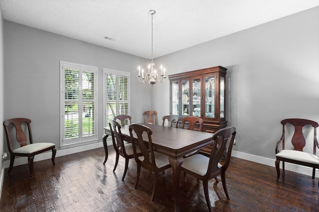 2304 Colleen Ct, Carrollton, TX 75007 - dining room with a chandelier and dark wood-style flooring