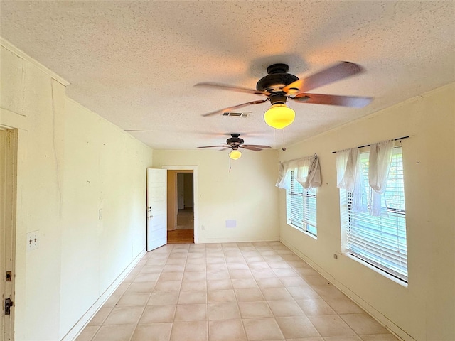 202 Powell Rd, Weatherford, TX 76088 - spare room featuring a textured ceiling and ceiling fan