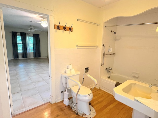 202 Powell Rd, Weatherford, TX 76088 - full bathroom featuring toilet, shower / bathtub combination, wood finished floors, and ceiling fan